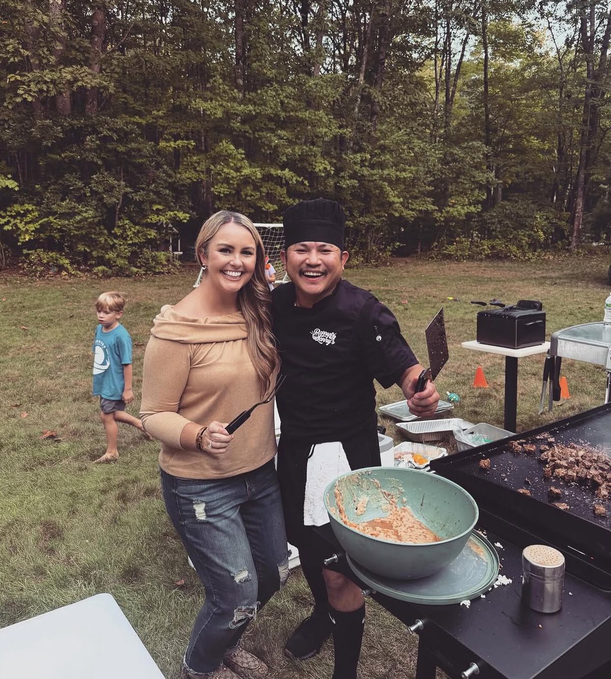 Barry Larry cooking hibachi-style for a customer at an outdoor event