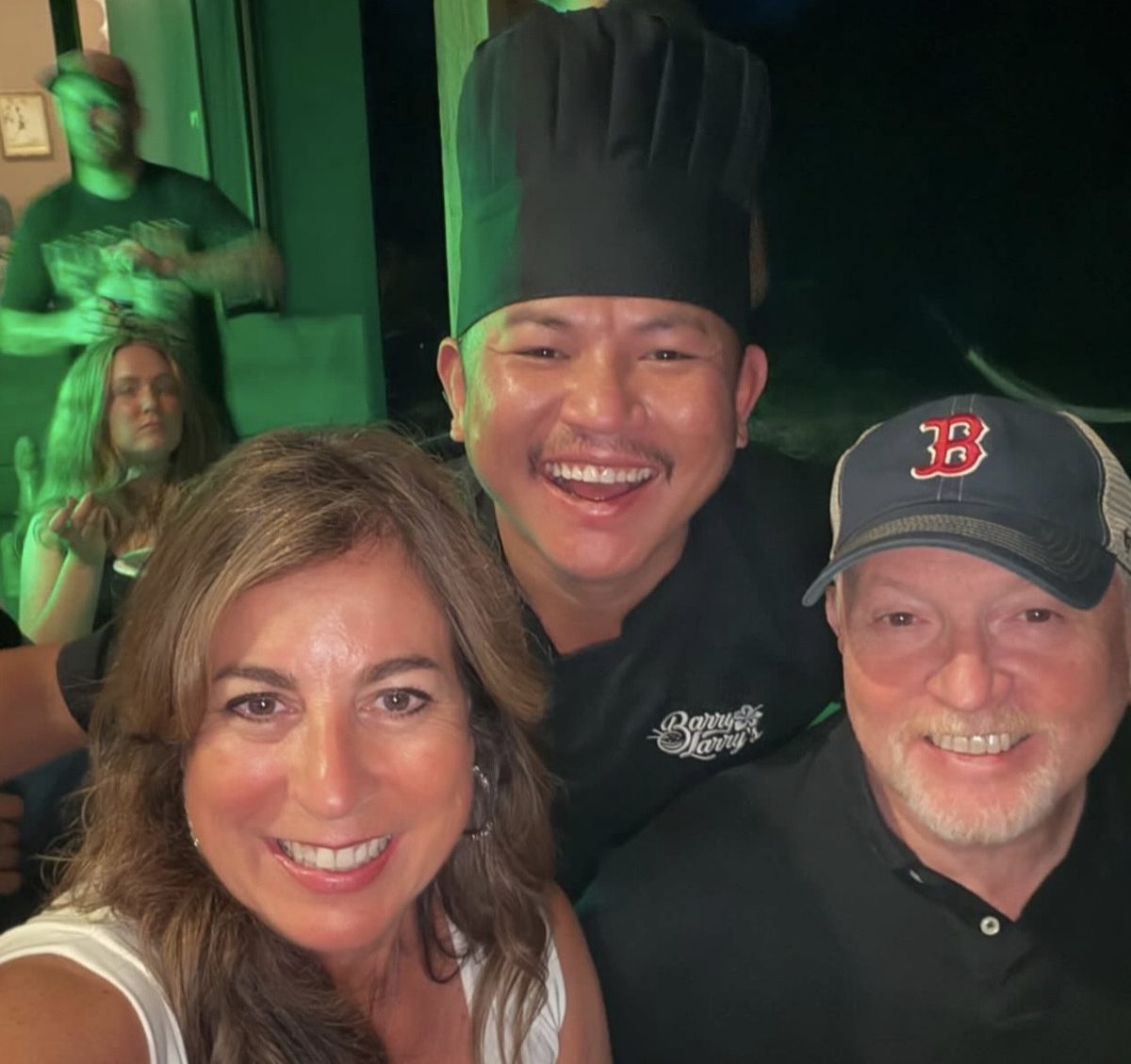Barry Larry taking a selfie with happy customers at a private event