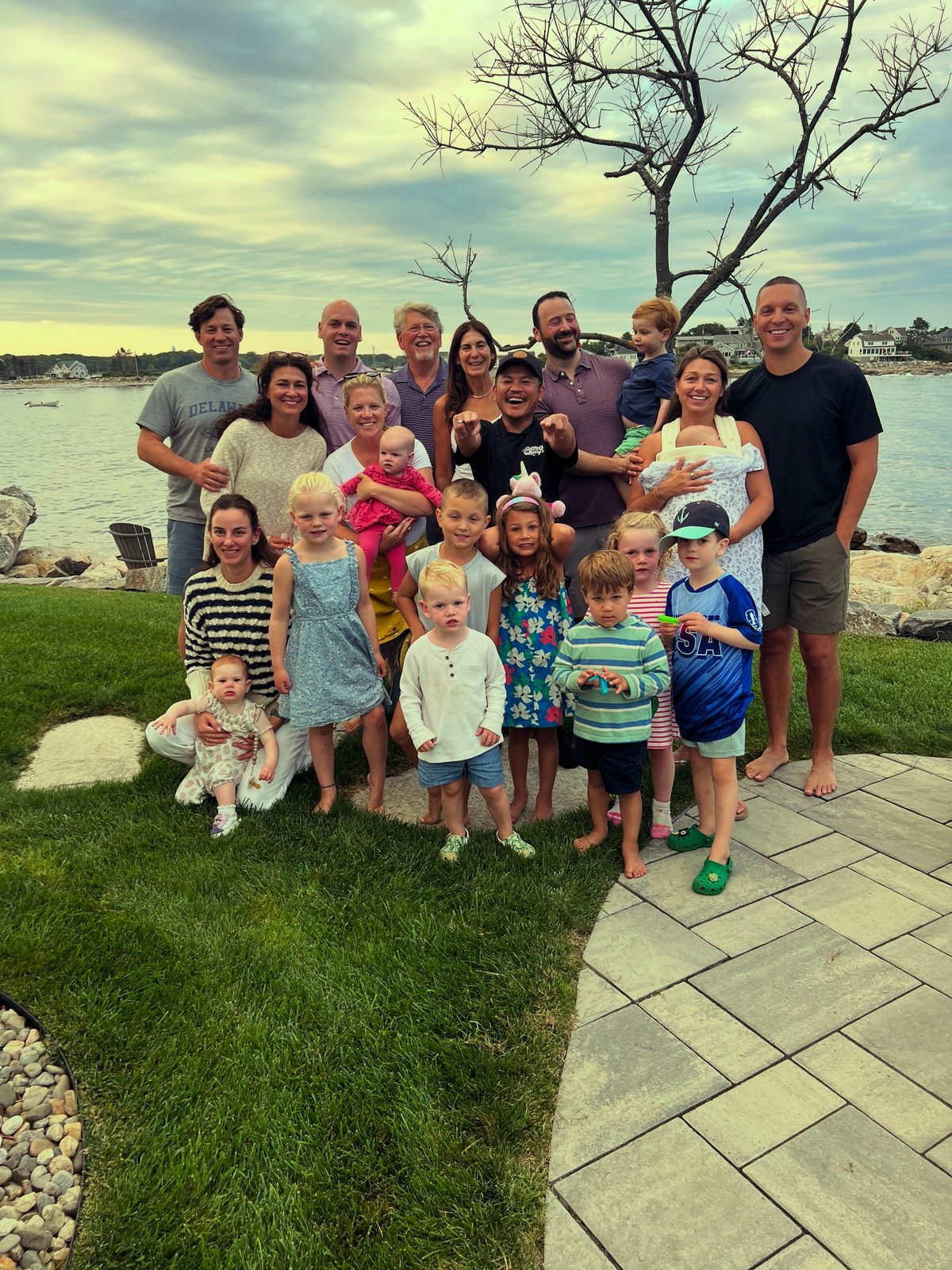 Barry Larry with a large family group at a waterfront private hibachi event